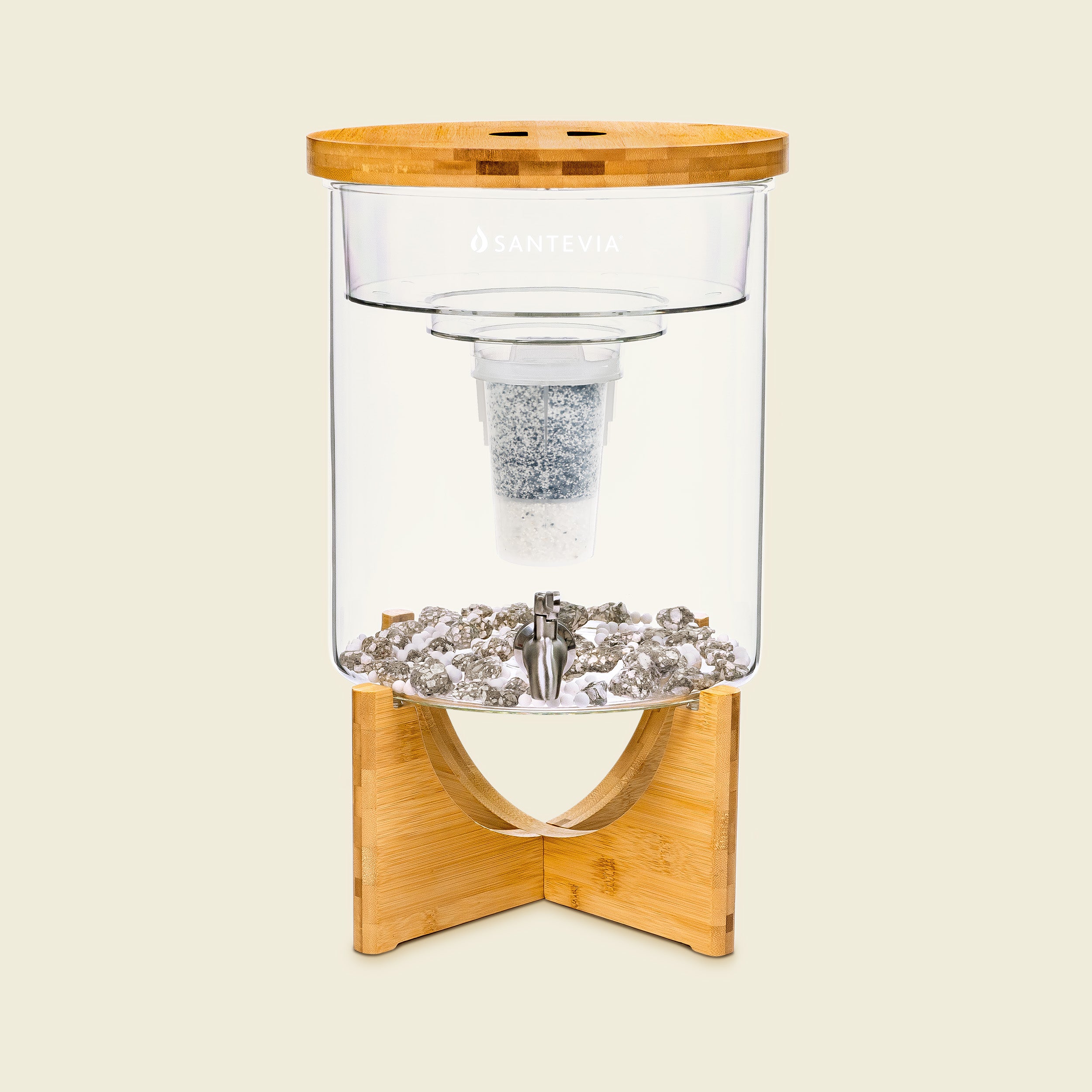 Clear glass container with wooden base and lid on a beige background