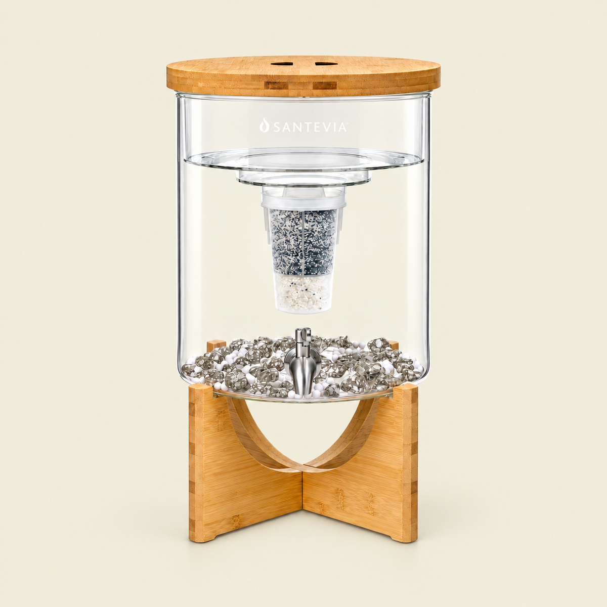 Imge of a the Santevia Glass Water System on a warmstone background. A Clear glass container with wooden base and lid on a beige background