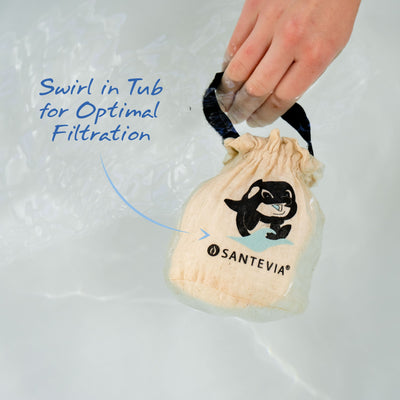 A Santevia Bath Filter being swirled in a bath tub.
