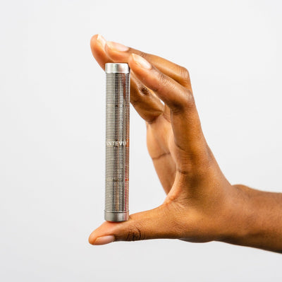 Closeup of a someone's hand holding a Santevia Water Bottle Filter