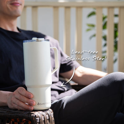 Man on porch smiling with Santevia 900 mL Ivory Tumbler. Lead-free Stainless Steel.